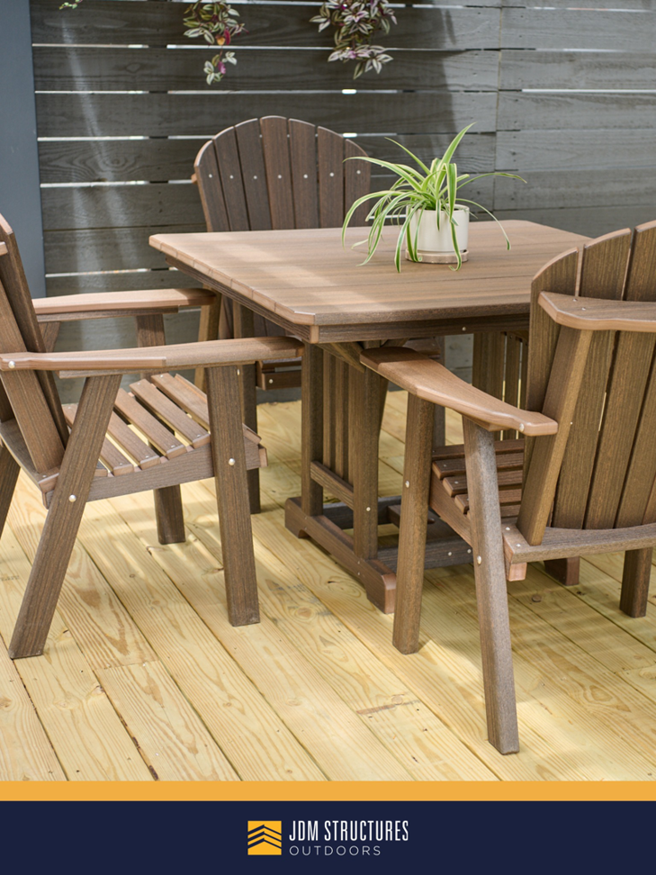 A newly constructed wooden deck with outdoor patio furniture and a slatted fence by JDM Outdoors of Robinson in Pittsburgh, PA.