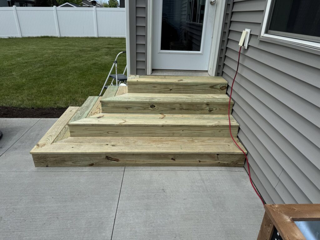 Outdoor wooden steps installation completed by Midwest Handyman LLC in West Fargo, ND.