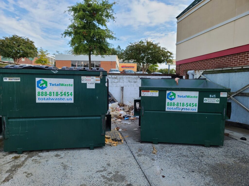 An overflowing commercial dumpster from Total Waste next to another, ready for junk removal in Baltimore, MD.