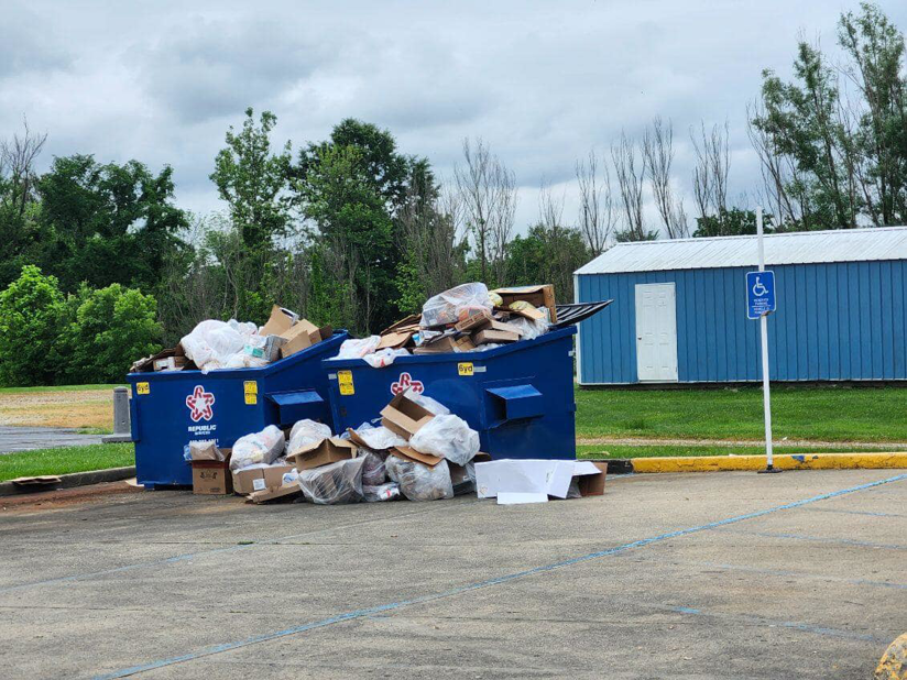 Overflowing commercial dumpsters filled with trash and boxes, a junk removal need for Odees_hauling_services, Indianapolis, IN.