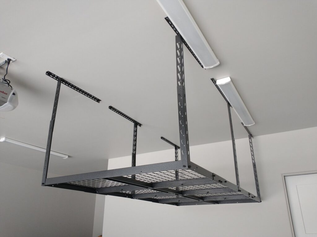 A sturdy overhead garage storage rack professionally installed on the ceiling by Boise Handyman & Remodel in Boise, ID.