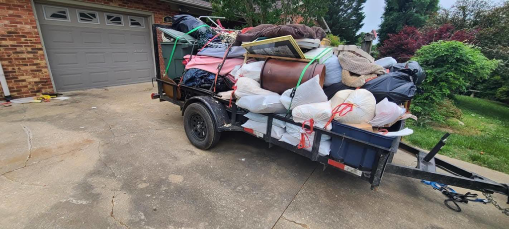 An overloaded trailer filled with household junk and debris, ready for removal by JUNK BRO'S in Hickory, NC.