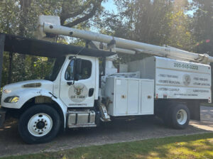 An Ox Tree service truck displaying company logo and a list of services offered in Birmingham, AL.