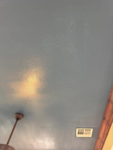 A freshly painted dark blue ceiling with an installed air vent, showcasing work by Sanders Construction & Handyman Services, LLC in Oklahoma City, OK.