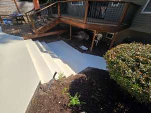 Newly painted concrete stairs leading to a pool area, completed by Done Right Handy in Wilmington, DE.