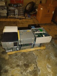 Pallets stacked with old computer towers for e-waste recycling at Mid Atlantic Recycling Solutions, LLC in Norfolk, VA.