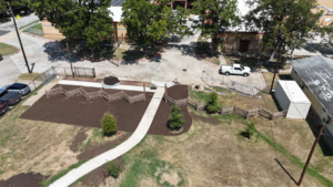 Aerial view of park construction with new paths, mulch, and fencing by Paradigm Contracting LLC in Wichita, KS.
