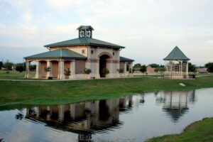 A park pavilion and gazebo next to a pond, constructed by Reeder General Contractors, Inc. in Fort Worth, TX