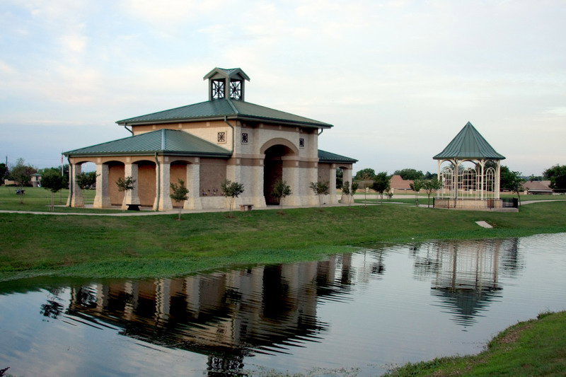 A park pavilion and gazebo next to a pond, constructed by Reeder General Contractors, Inc. in Fort Worth, TX