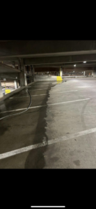 A parking garage floor cleaning project underway by RWD Construction in San Antonio, TX.