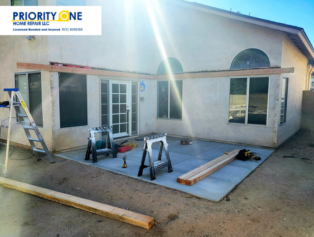 A patio cover under construction at a home by Priority One Home Repair LLC in Glendale, AZ
