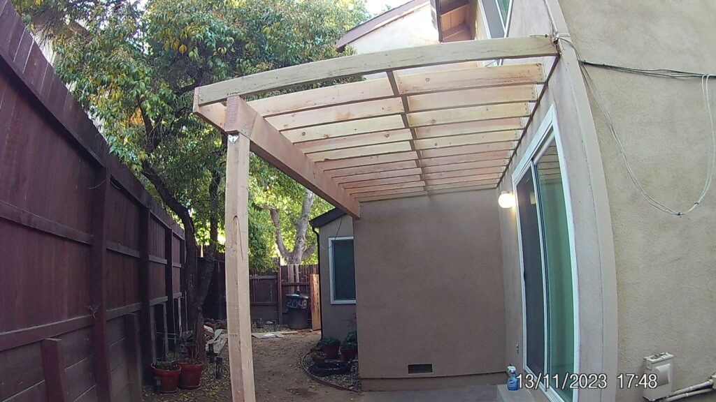 Wooden patio cover or pergola framing under construction by Carpenter Joe's Handyman Service in Sacramento, CA