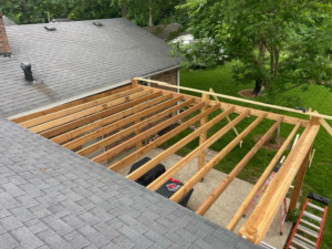 Overhead view of a patio cover roof framing during construction by HC Homes & Consulting in Bowling Green, KY.
