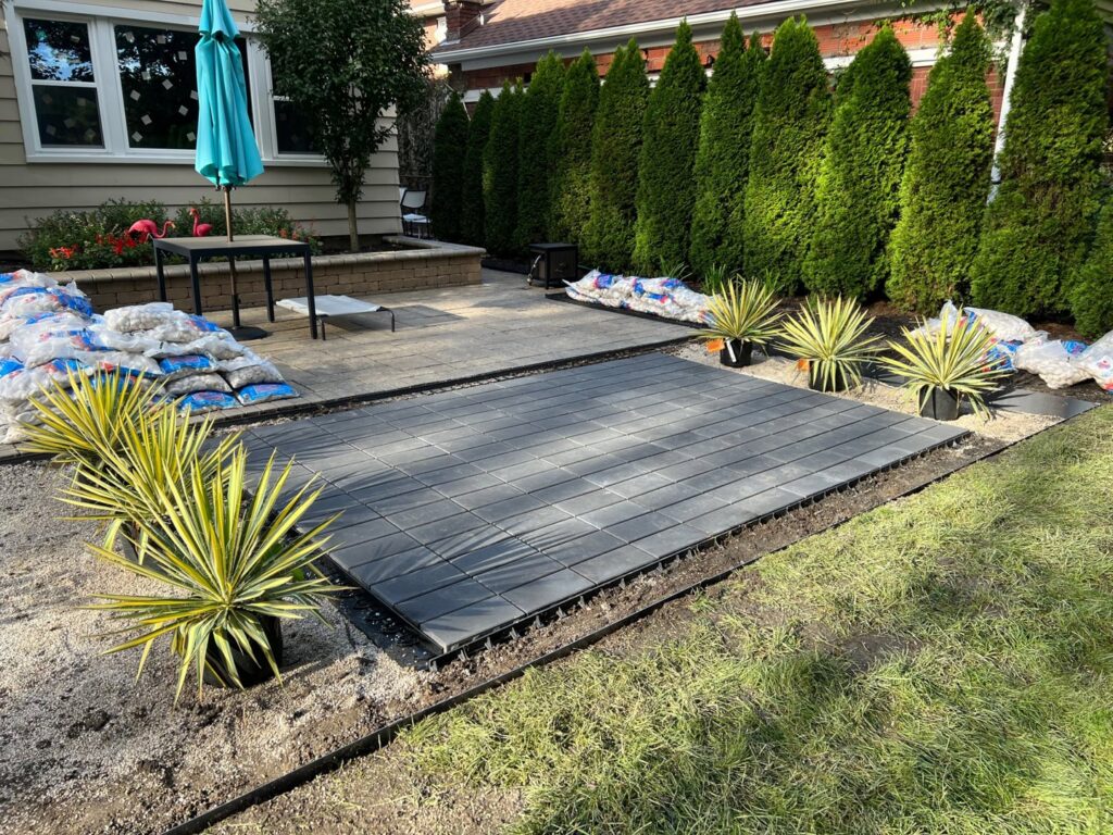 Outdoor patio installation in progress, showing pavers and gravel base by Inspired Renovation & Hardscape's in Lorain, OH.