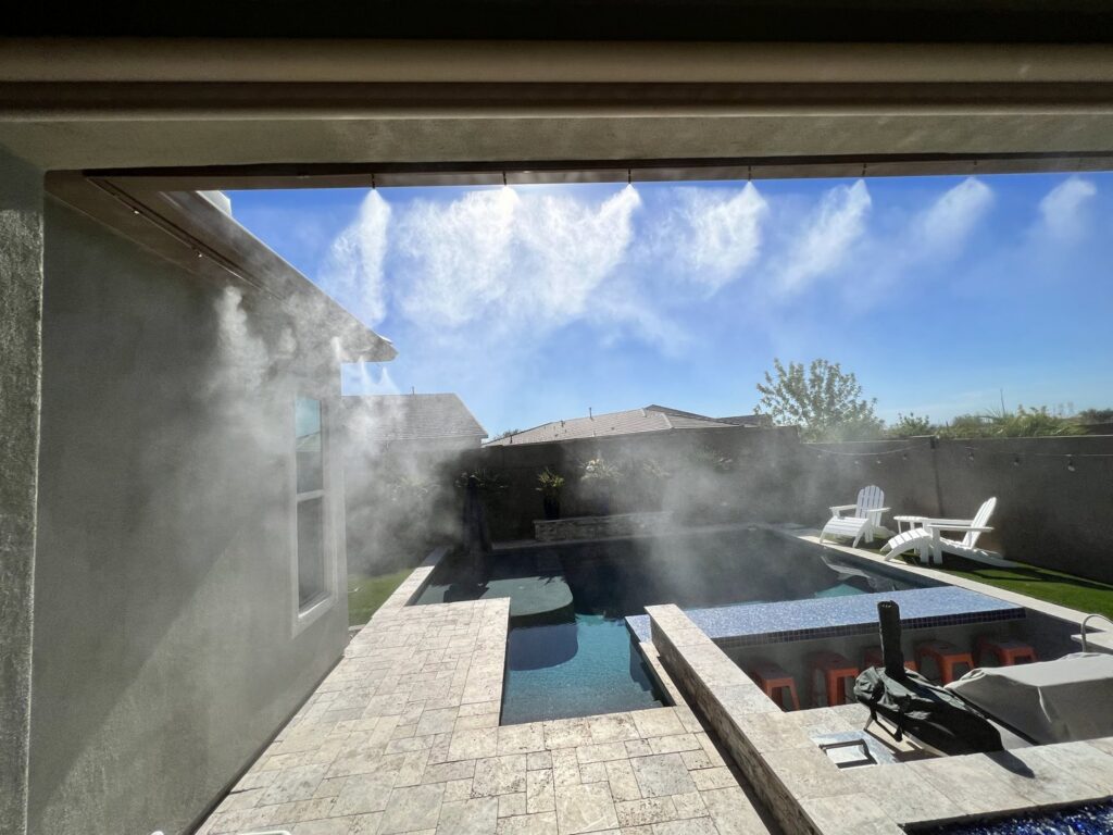 A high-quality mist system installed on a patio overlooking a beautiful pool by Mr. Mister in Surprise, AZ