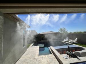 A high-quality mist system installed on a patio overlooking a beautiful pool by Mr. Mister in Surprise, AZ