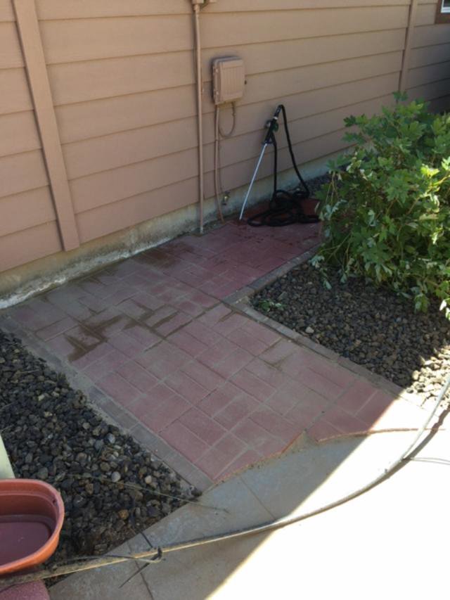 An outdoor patio area with newly installed brick pavers and decorative gravel by Rod's Handyman Services, LLC in Boise, ID.