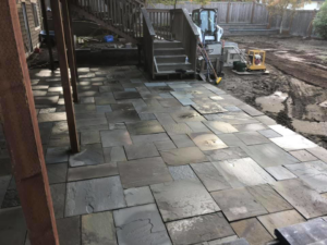 A new backyard patio being installed with pavers by M.C.Dirtworks, a handyman service in Caldwell, ID.
