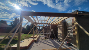 Wooden framing for a new patio roof under construction by Classic Home Concepts in Springfield, MO