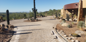 A beautifully paved driveway with desert landscaping by Vasquez Construction Company, INC. in Redmond, OR.