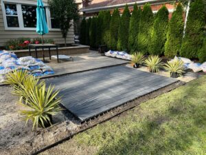 Paver patio installation in progress, showing materials and groundwork by Inspired Renovation & Hardscape's in Lorain, OH.