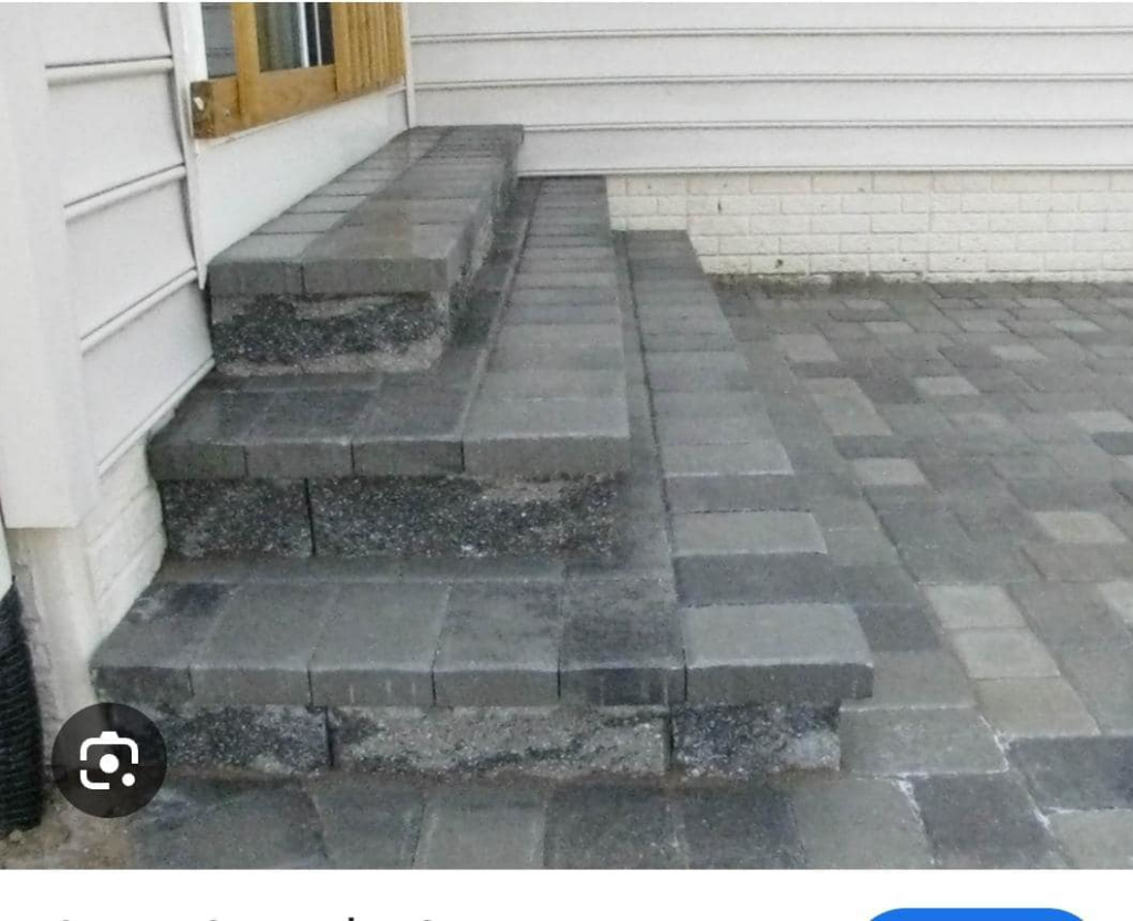 Newly installed paver steps and patio by Titan Built Construction, LLC, offering hardscaping and handyman services in Huntersville, NC.