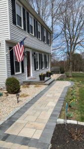A newly installed paver walkway leading to a home by Tomori's masonry llc in Cheshire, CT