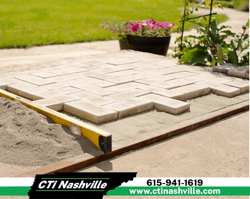 Handyman installing pavers in a herringbone pattern for a new patio or walkway, a service by CTi Nashville in Antioch, TN.
