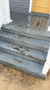Wooden porch stairs with significant peeling paint, indicating a need for repair by Isac's General Services LLC in Henrico, VA