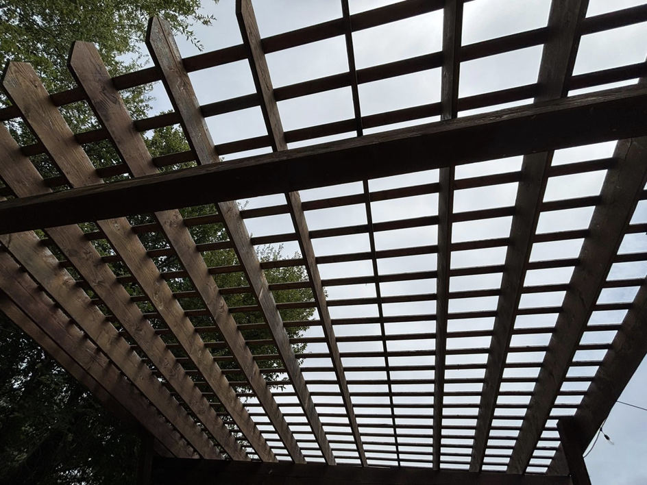 Close-up detail of the wooden roof slats of a pergola built by Oklahoma Painting & Construction in Oklahoma City, OK.