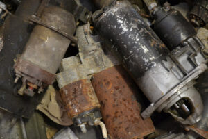 A pile of old car starters and alternators collected for scrap metal recycling by Bee Green Recycling in Richmond, VA