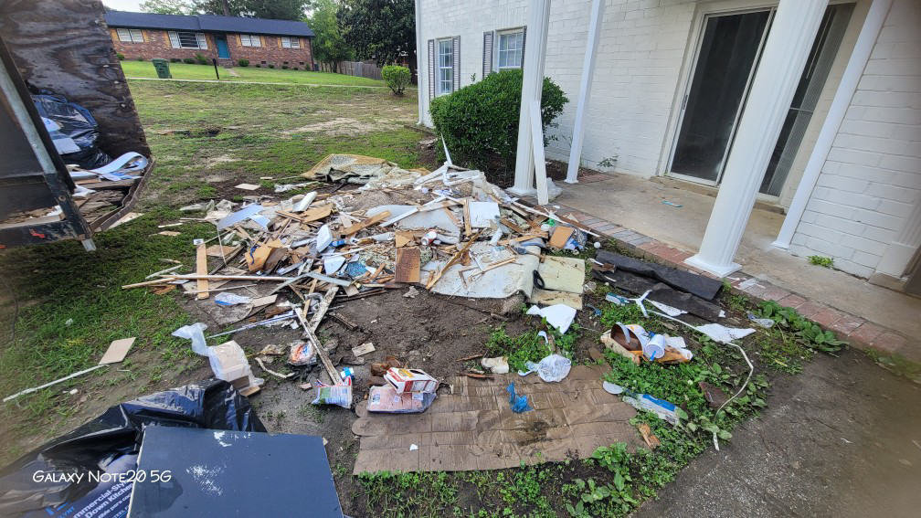 A large pile of construction debris and junk awaiting removal by Ashworth Clean Up Crew LLC in West Columbia, SC.