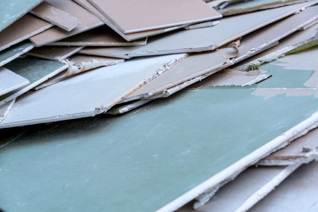 A large pile of broken drywall and construction debris, ready for removal by Junk Movers in Salt Lake City, UT.