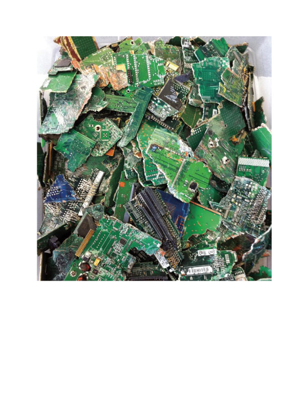A pile of electronic waste (e-waste) circuit boards ready for recycling by Hugo Neu Recycling in Mount Vernon, NY.