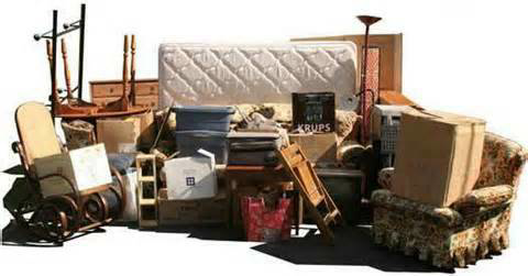 A large pile of household junk including a mattress, chairs, and boxes, ready for removal by DFW Service People in Dallas, TX.