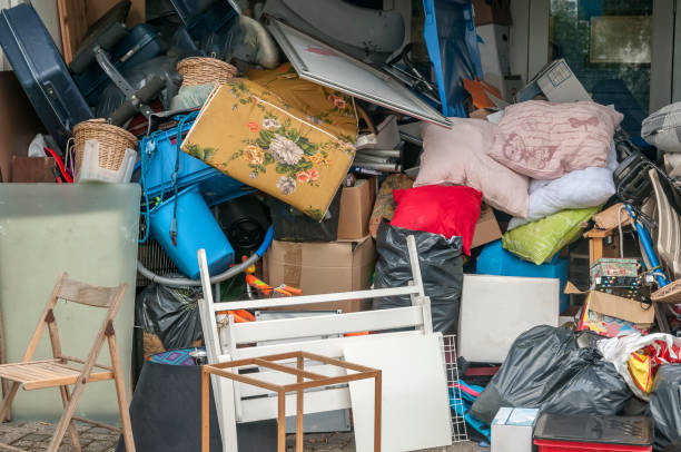 A large pile of household junk, including furniture and boxes, ready for removal by Great White Junk Removal in San Francisco, CA.