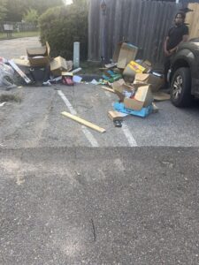 A large pile of cardboard boxes and various junk items awaiting removal by Bluff City Dumpsters in Memphis, TN.