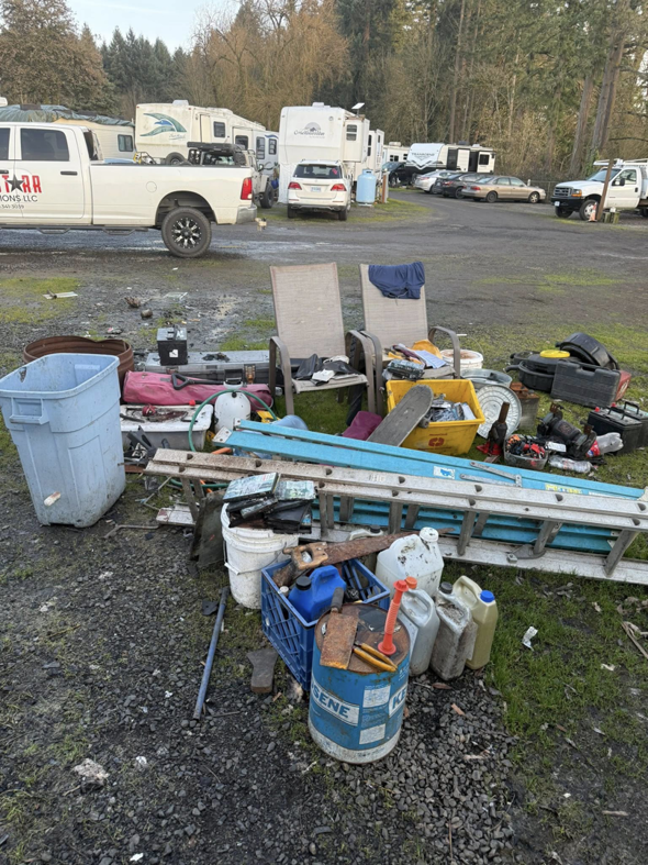 A large pile of miscellaneous junk, including chairs, buckets, and ladders, ready for removal by AllStarr Solutions Hauling and Junk Removal in Newberg, OR.