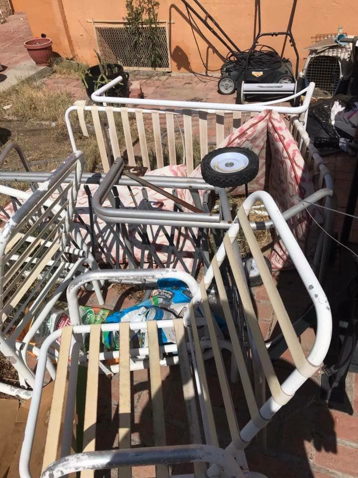 A pile of old patio furniture and outdoor junk awaiting removal by El Paso Junk Removal and Hauling in El Paso, TX.