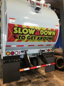 A large pile of white trash bags and cardboard boxes awaiting junk removal by Whitecap Waste in Beckley, WV.