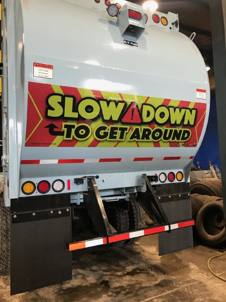 A large pile of white trash bags and cardboard boxes awaiting junk removal by Whitecap Waste in Beckley, WV.