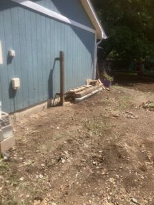 A pile of wood and construction debris ready for removal by Trash It All Hauling And Junk Removal LLC in Fort Collins, CO.