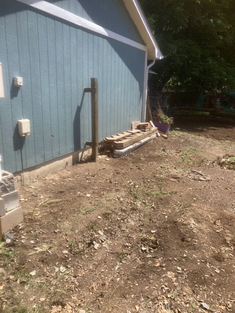 A pile of wood and construction debris ready for removal by Trash It All Hauling And Junk Removal LLC in Fort Collins, CO.