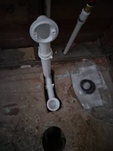 Close-up of new plumbing drain pipe installation by Handyman Service in Lafayette, IN.