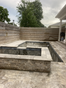 A pool and spa structure under construction, showing the concrete shell before plastering by JR'S POOLS Plastering LLC in Kenner, LA.