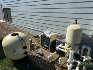 Pool equipment undergoing repair or installation by Titan Handyman, LLC in Lewes, DE.