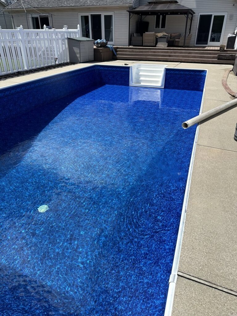 A swimming pool being filled with water after a liner replacement by Heatwave Pools LLC in Flint, MI.