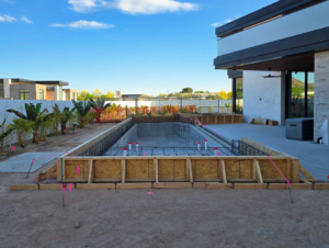 A pool foundation with rebar and wooden forms during construction by Premier Paradise, Inc. in Gilbert, AZ.