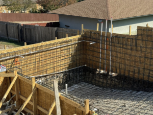 Rebar and formwork for a pool or large foundation with plumbing installed by Stealth Civil Contracting in Austin, TX.