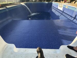 A new pool liner installation with water being filled into the pool by Heatwave Pools LLC in Flint, MI.
